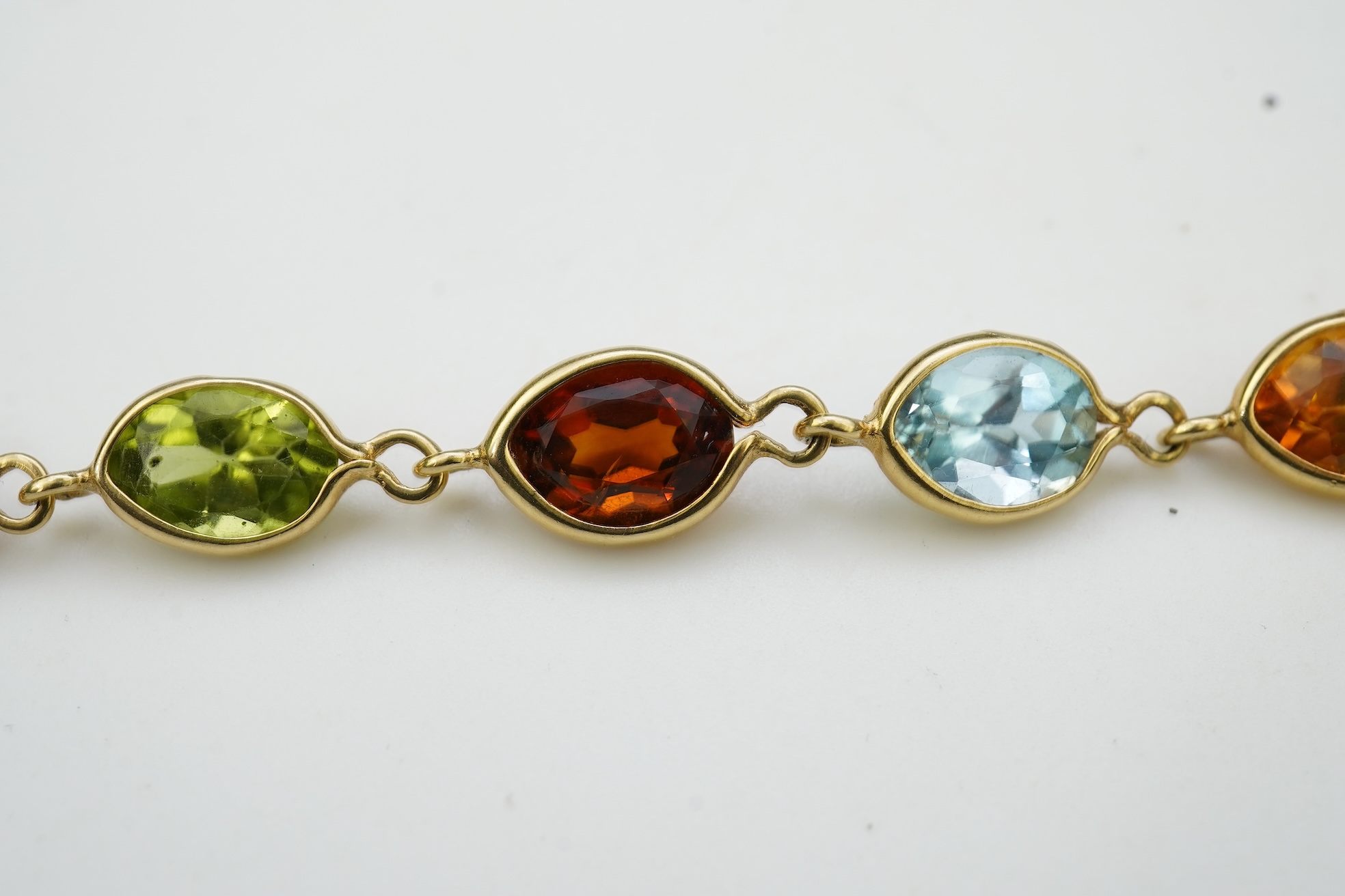 A gold and gem-set bracelet